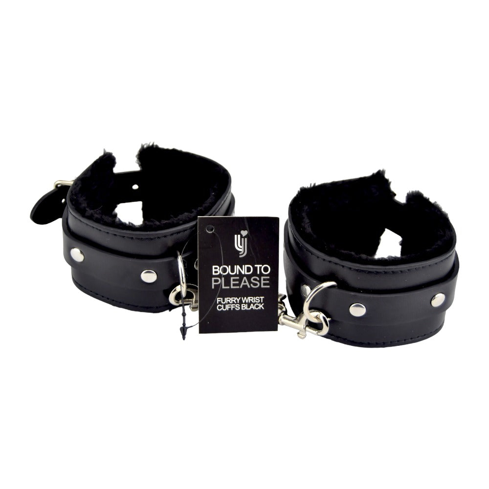 Black furry plush wrist cuffs from Bound to Please, soft bondage restraints with secure fastening for comfortable wear.