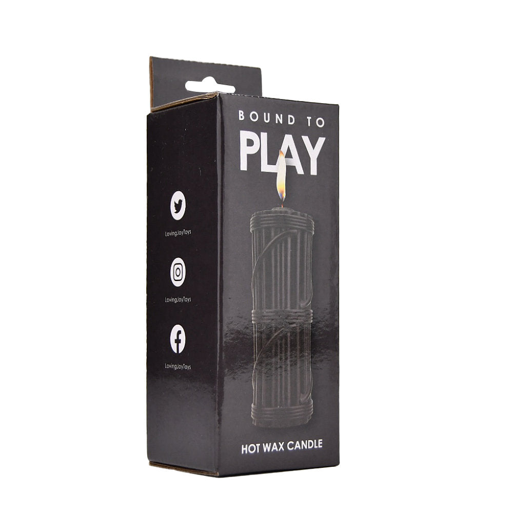 Bound to Play hot wax candle in black, a massage oil and candle for relaxation, shown in its packaging.
