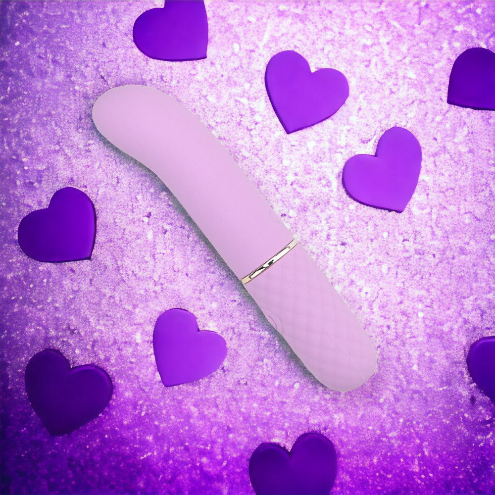 NAUTI Petites 10-speed G-Spot vibrator with heart-shaped accents, compact design, and textured surface for enhanced pleasure.