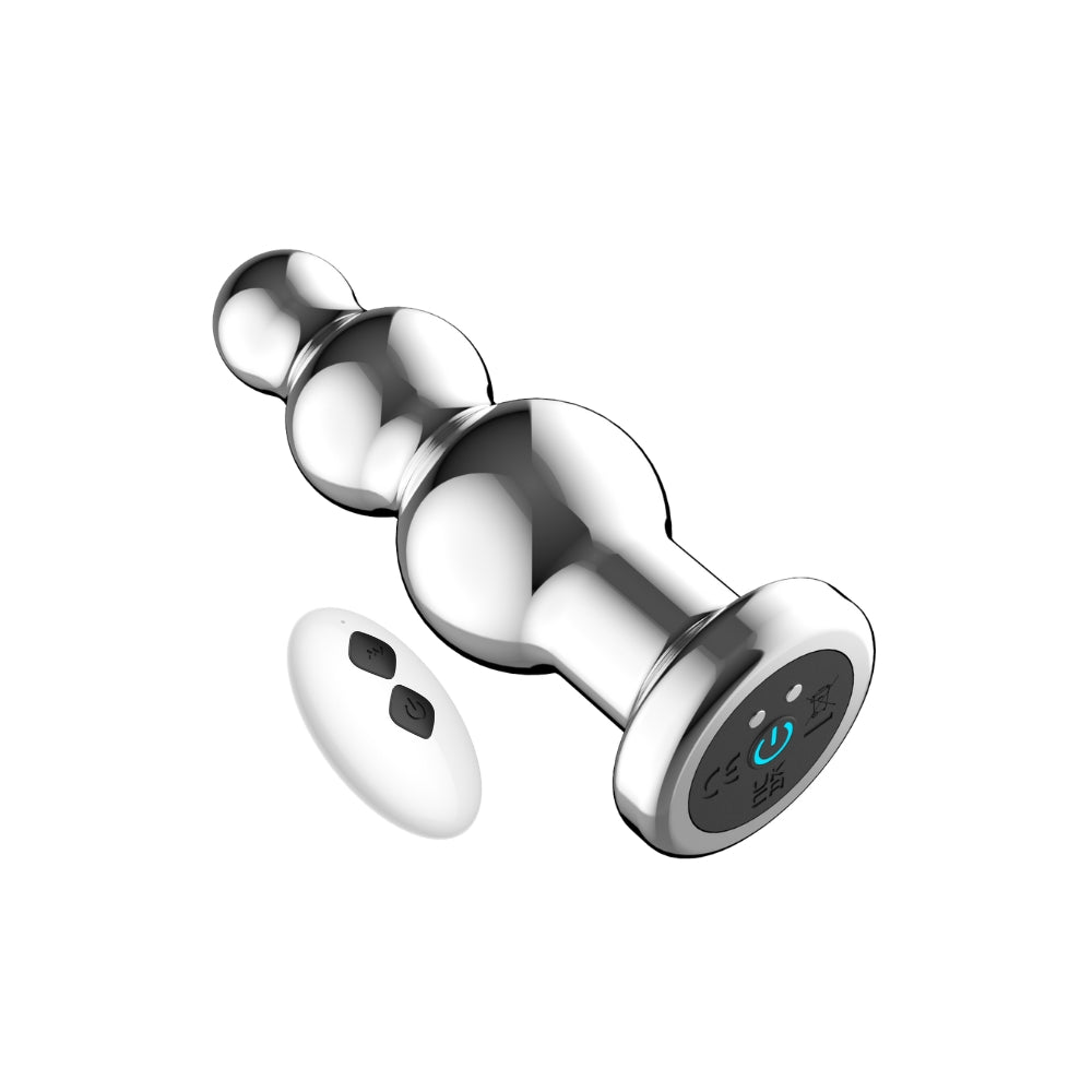 Toosh remote-controlled metal vibrating anal beads on a soft surface, showcasing their sleek design and smooth finish.