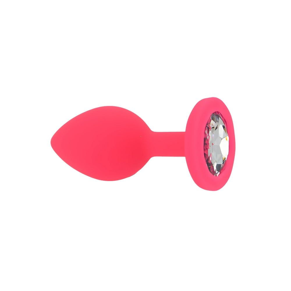Small pink silicone butt plug by Toosh, featuring a tapered design and smooth surface for comfortable use.