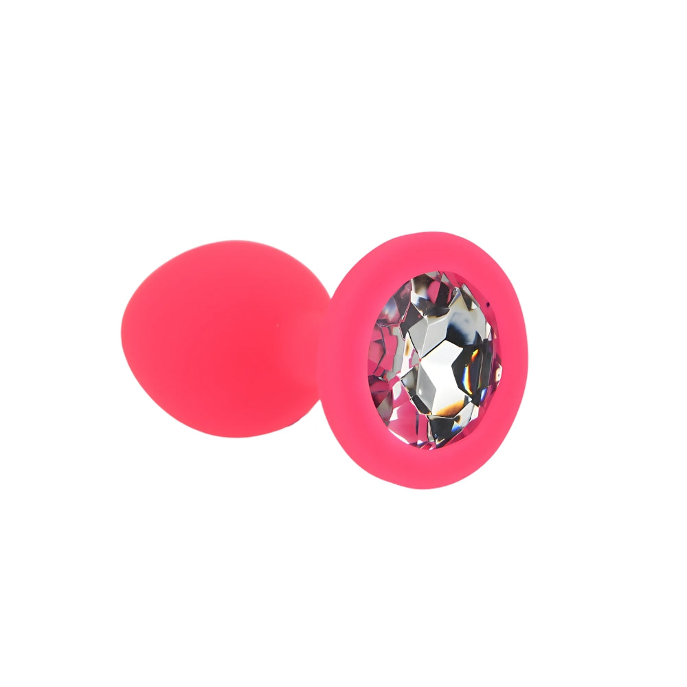 Small pink silicone butt plug by Toosh, featuring a smooth design and tapered tip for comfortable use.