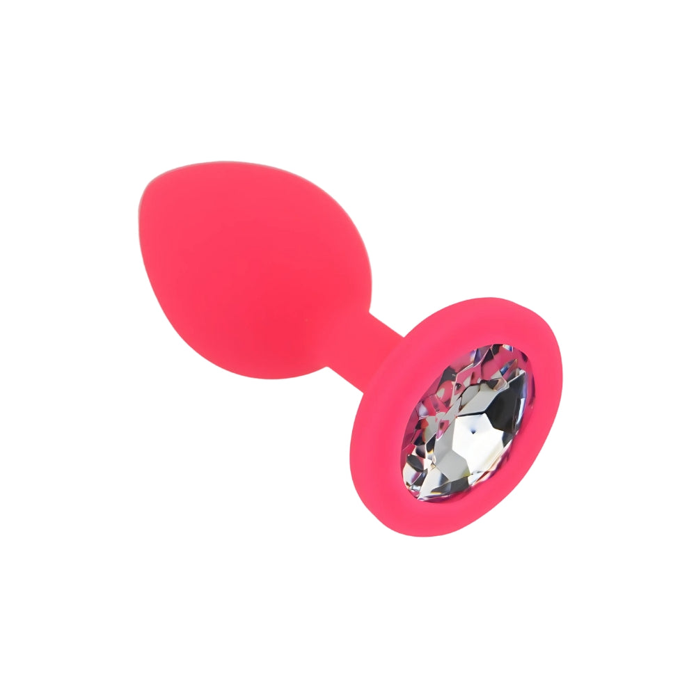 Small pink silicone butt plug by Toosh, showcasing its smooth design and tapered shape for comfortable use.