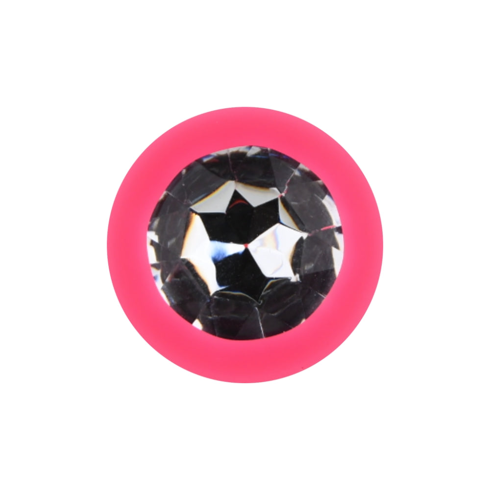 Small pink silicone butt plug by Toosh, featuring a smooth surface and tapered design for comfortable use.
