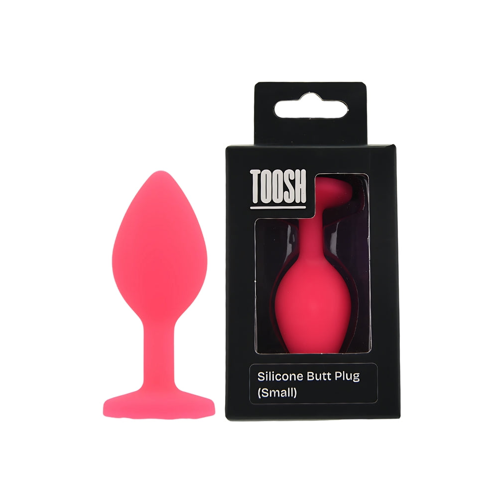 Small pink silicone butt plug by Toosh, featuring a smooth finish and tapered design for comfortable use.