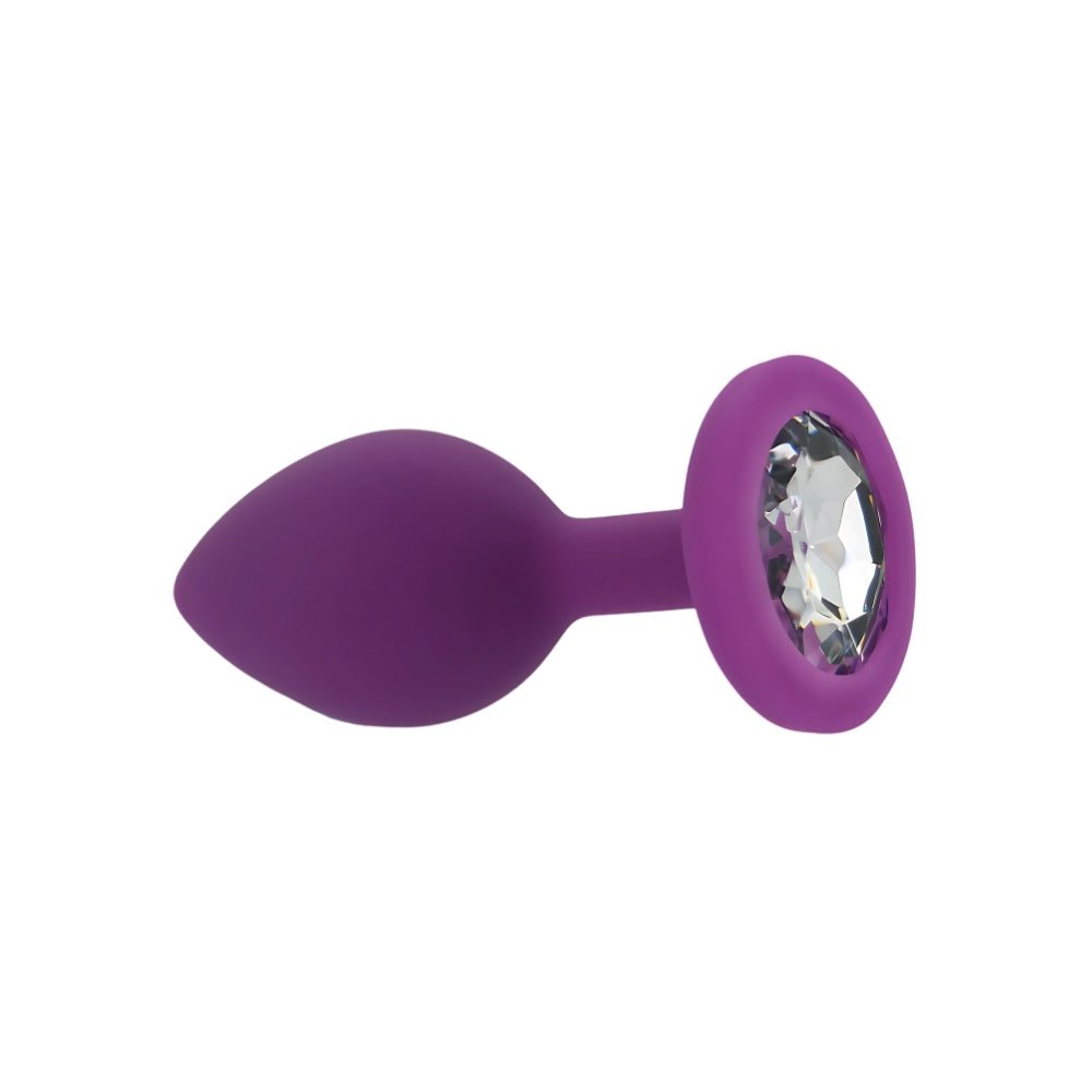 Small purple silicone butt plug from Toosh, designed for comfort and discreet pleasure, shown in a close-up image.