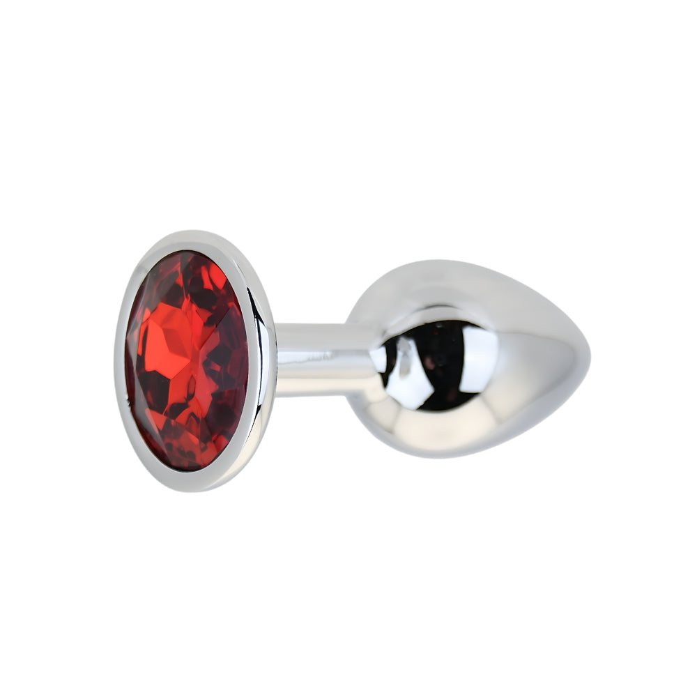 Toosh silver metal butt plug with small red stone, smooth finish, compact size, and tapered shape for comfortable wear.