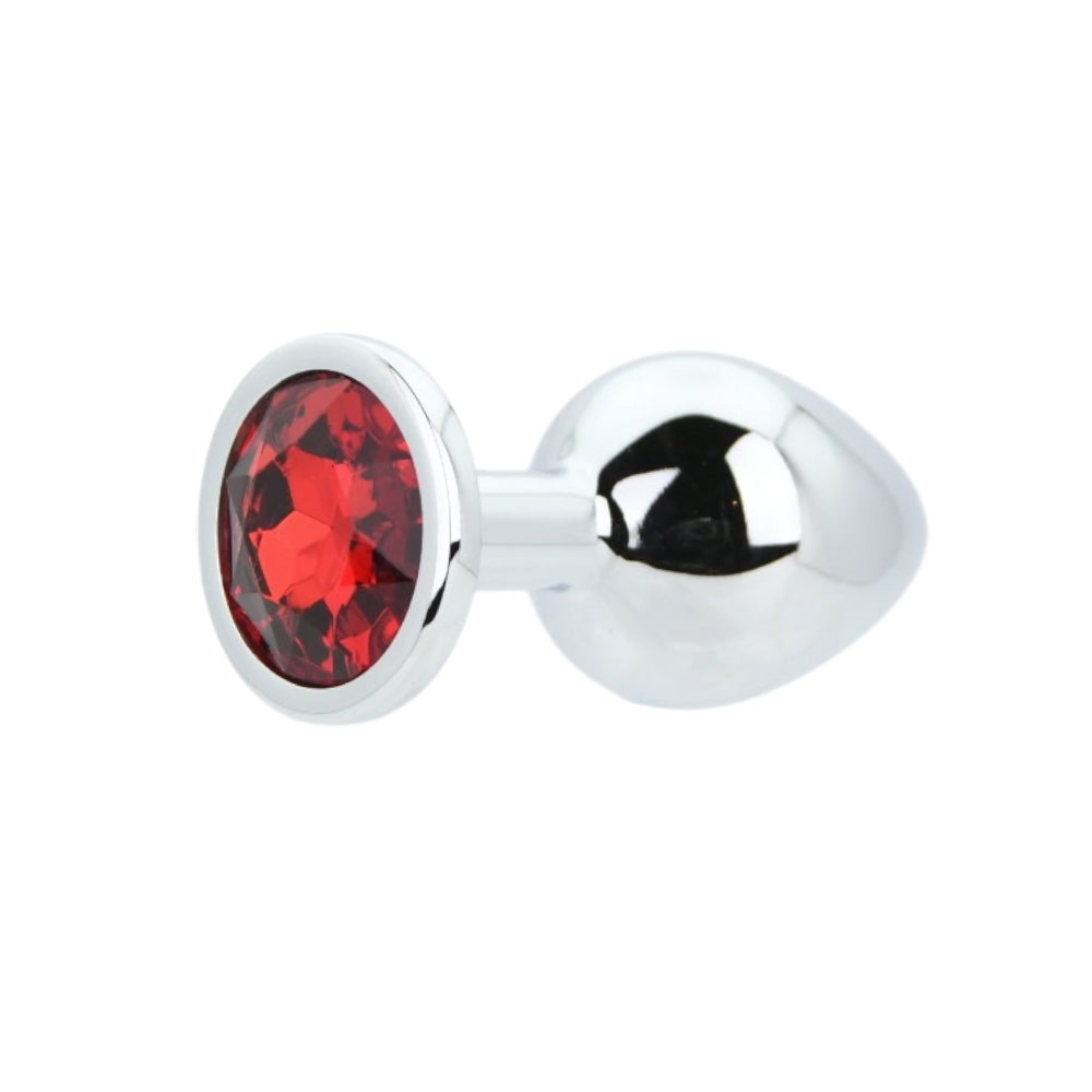 Toosh silver metal butt plug with a medium red stone, showcasing its sleek design and elegant finish.