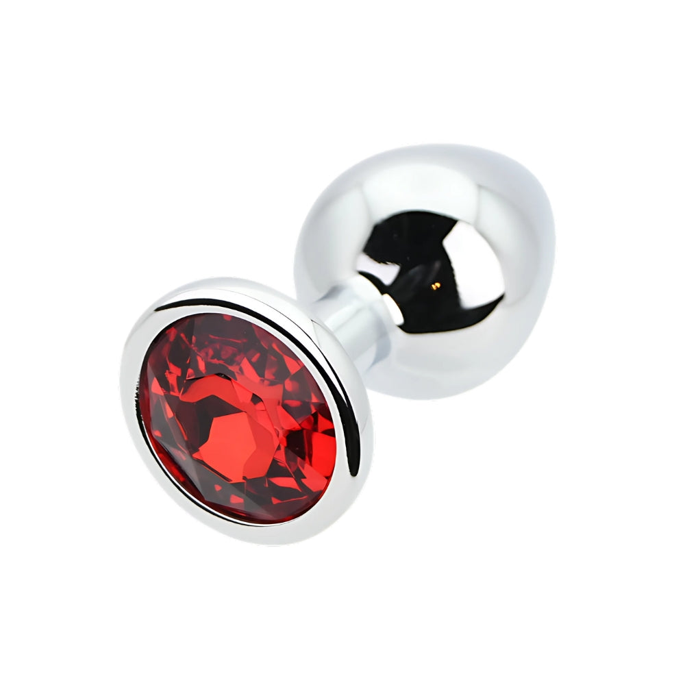 Medium silver metal butt plug by Toosh with a striking red stone accent.