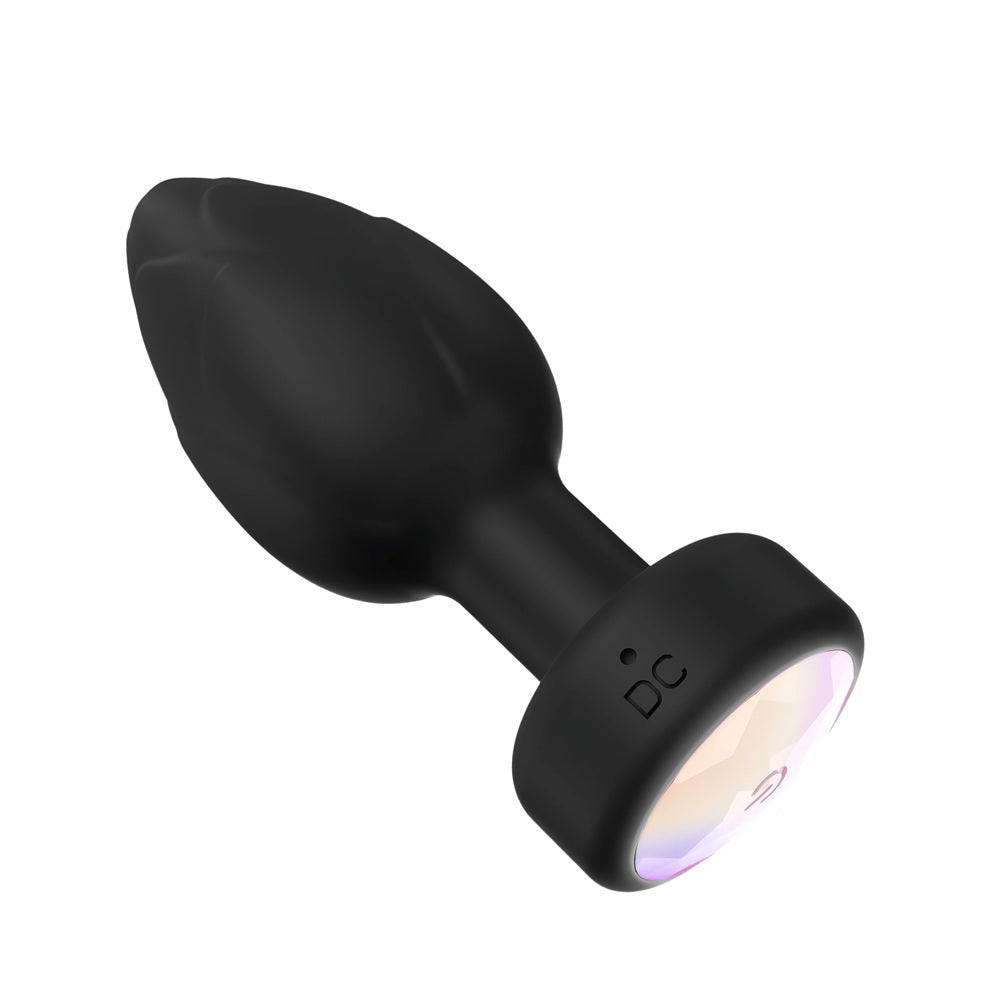 Toosh remote-controlled light-up vibrating butt plug with smooth design and flexible anal beads for enhanced pleasure.