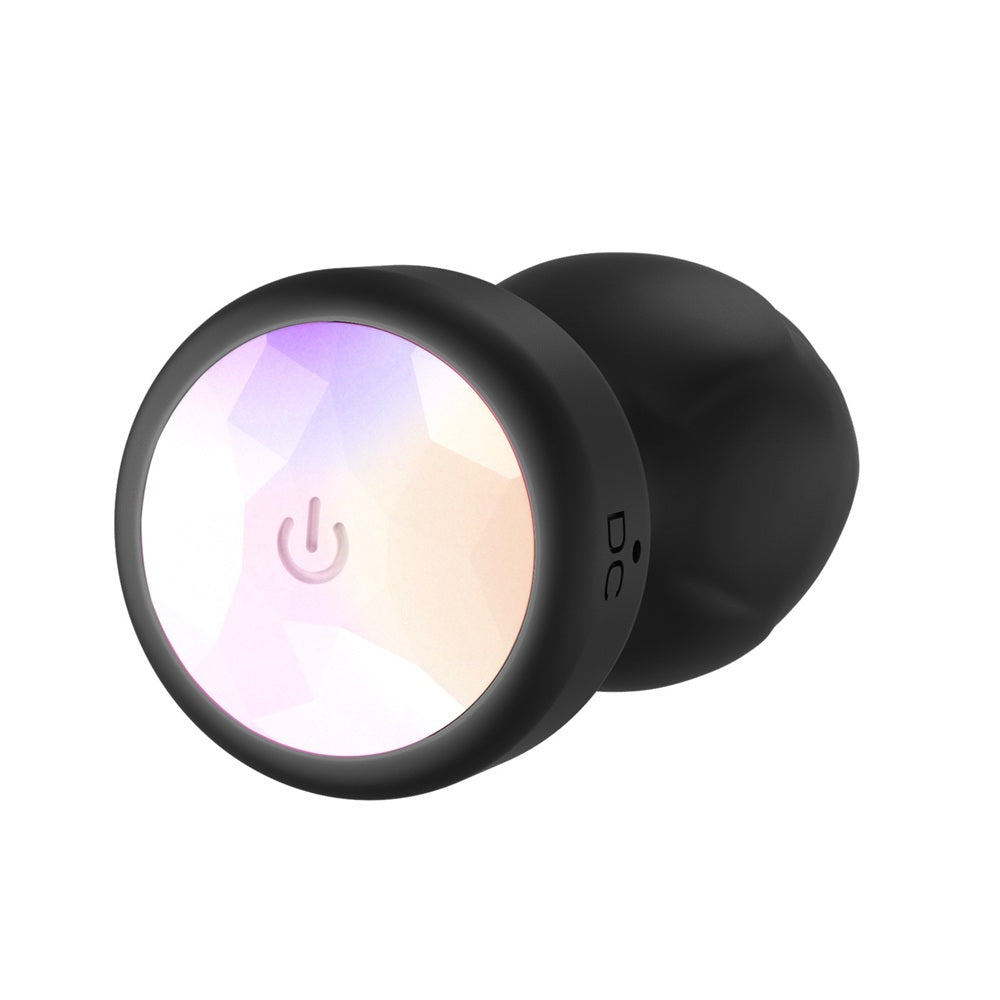 Toosh remote controlled light up vibrating butt plug with smooth design and vibrant colors for enhanced pleasure.