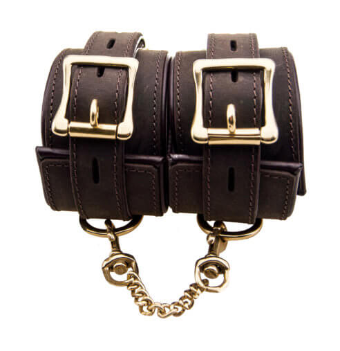 Bound Nubuck Leather Wrist Restraints with adjustable straps and metal hardware, designed for bondage restraint play.